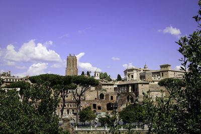 Buildings in city against sky