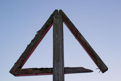 Low angle view of wooden structure against clear sky