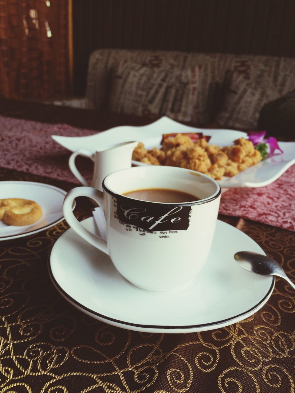 food and drink, indoors, freshness, table, drink, food, coffee cup, still life, refreshment, plate, ready-to-eat, coffee - drink, saucer, sweet food, indulgence, breakfast, dessert, serving size, spoon, close-up