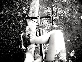 High angle view of woman sitting on bicycle