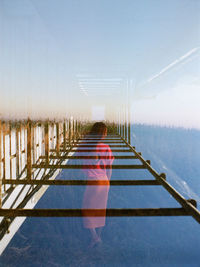 Pier over sea against clear sky