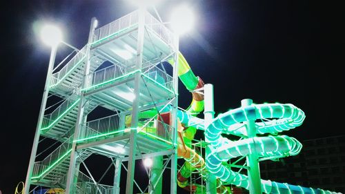 Low angle view of illuminated lights at night