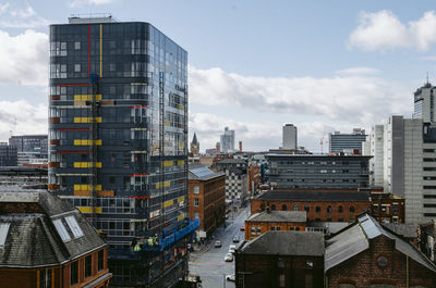 High angle view of buildings in city against sky