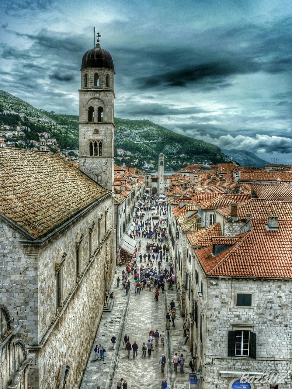 architecture, building exterior, built structure, sky, church, cloud - sky, place of worship, religion, tower, residential structure, city, cloud, roof, spirituality, residential building, house, cloudy, day