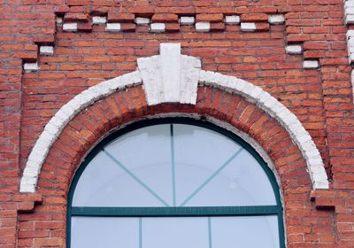 Low angle view of brick wall of building