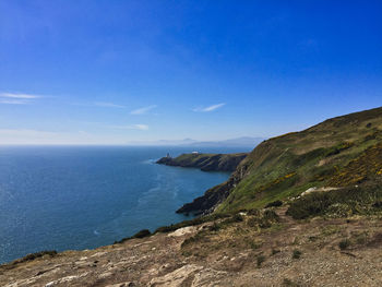 Scenic view of sea against blue sky