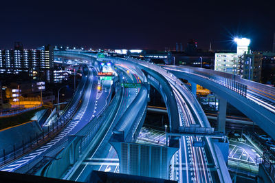 High angle view of light trails on road at night