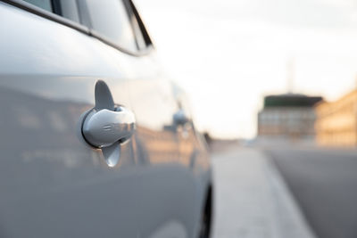 Close-up of car on street