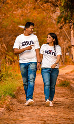 Full length of a young couple standing on land