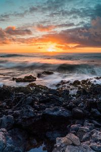 Scenic view of sea against sky during sunset