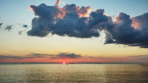 Scenic view of sea against sky at sunset