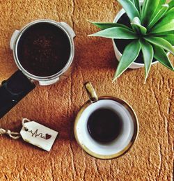 High angle view of black coffee on table