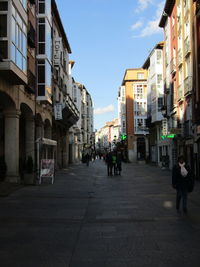 People walking on street in city