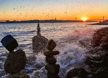 Scenic view of sea against sky at sunset