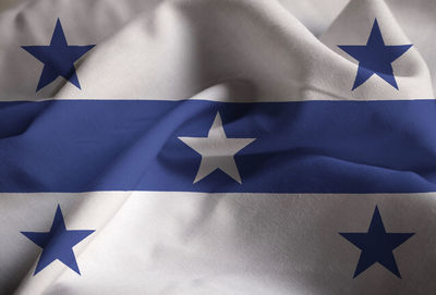 High angle view of flag against blue background