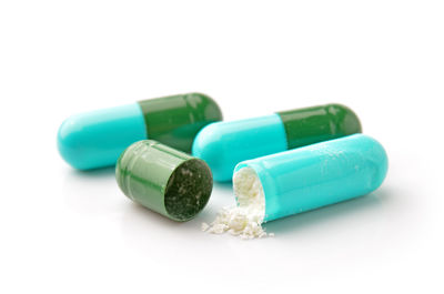 Close-up of capsules on white background