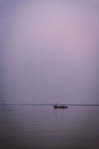 Scenic view of sea against sky at dusk