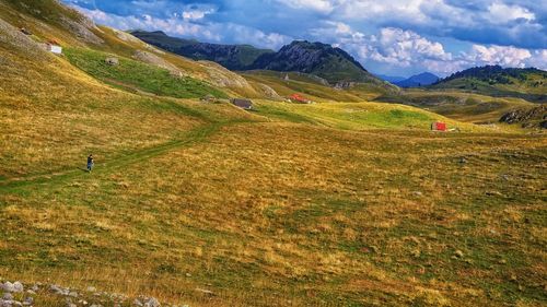Scenic view of landscape and mountains against sky