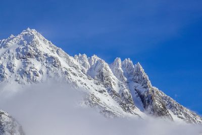 Low angle view of snow against sky