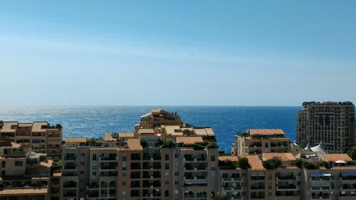 View of cityscape against blue sky