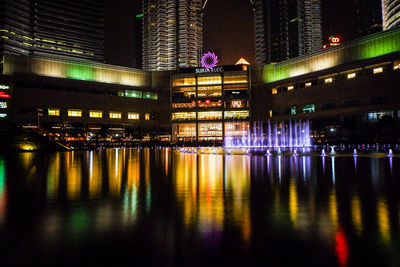 Illuminated buildings at waterfront