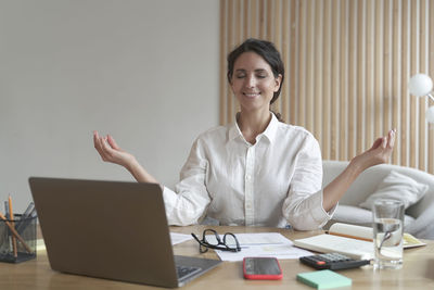 Businesswoman working at desk in office