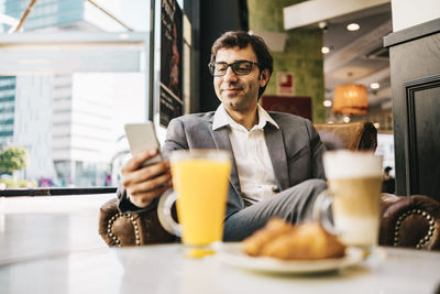 Portrait of a man having food in restaurant