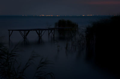 Scenic view of lake at sunset