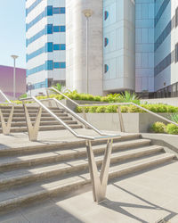 Staircase of building against sky in city