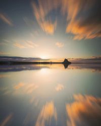 Scenic view of sea against sky at sunset