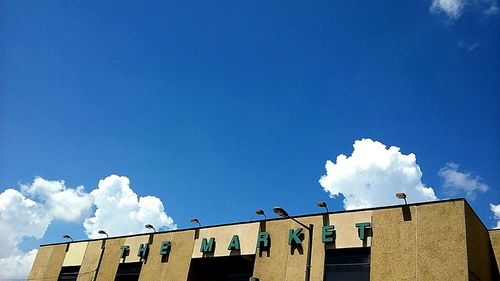 High section of building against blue sky