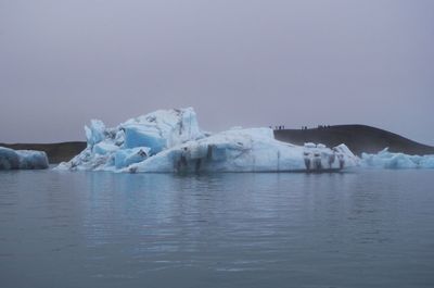 Scenic view of frozen lake against clear sky