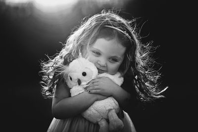 Portrait of girl holding toy