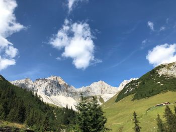 Panoramic view of snowcapped mountains against sky