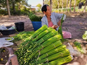 Woman having food in market