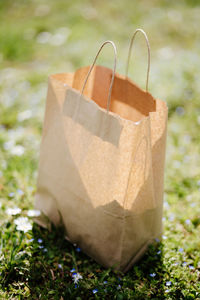 Close-up of gift box on field