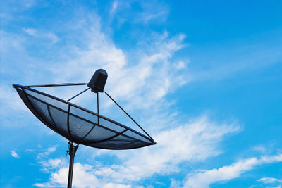 Low angle view of satellite dish against blue sky