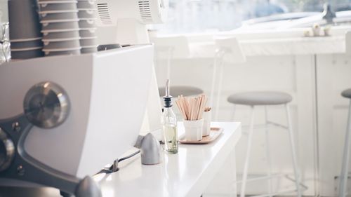 Close-up of coffee cups on table