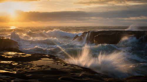 Scenic view of sea against sky during sunset