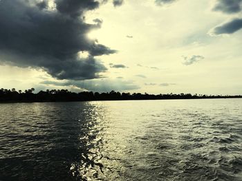Scenic view of lake against sky during sunset