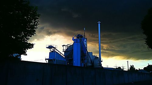 Low angle view of flags against sky during sunset