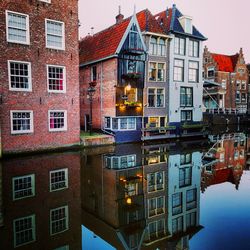 Houses against sky in city