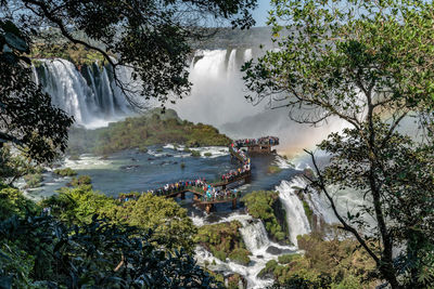 Tourists crowd on a walkway in the parque nacional iguazú on the argentina side of iguazu falls