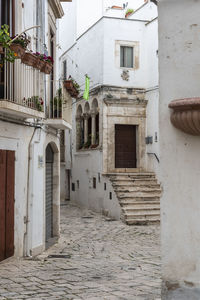 Alley amidst buildings in city