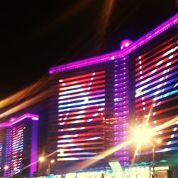 Low angle view of light trails at night