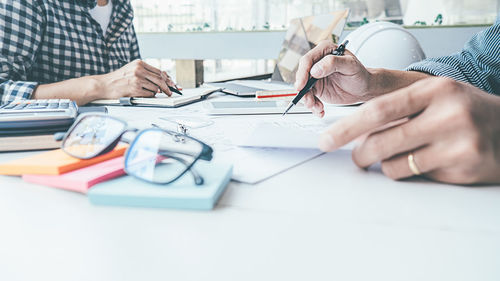 Midsection of woman working on table