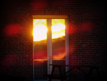 Sun shining through brick wall