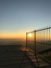 Scenic view of sea against clear sky during sunset