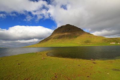 Scenic view of sea and mountains against sky