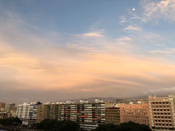 High angle view of buildings in city against sky